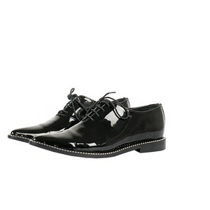 May include: A pair of black patent leather lace-up shoes with a pointed toe and a decorative trim around the sole.