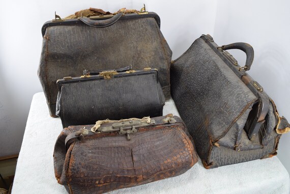 Lot of four (4) antique vintage leather doctor bag