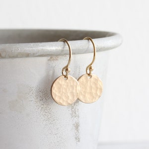 Gold hammered disc drop earrings