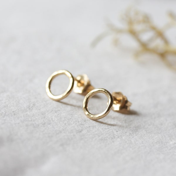 Tiny gold open circle stud earrings