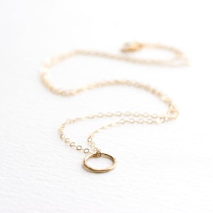 Tiny gold hammered circle necklace