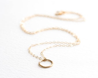 Tiny gold hammered circle necklace