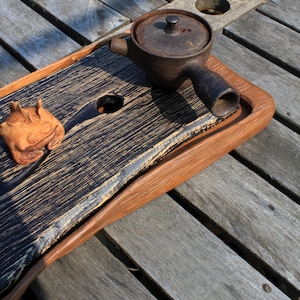 Gong fu tea table. Wabisabi tea tray made of wood for a tea ceremony.  Tea set.