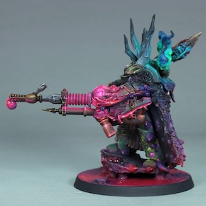 May include: A miniature figurine of a warrior in a kneeling position, featuring a detailed, colorful paint job. The figure is predominantly green, purple, and pink, with a large weapon. The base is a dark red with a black border. The overall aesthetic is fantasy-themed.