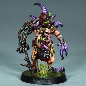 May include: A grotesque, fleshy, and bio-mechanical figure with a purple and green color scheme. The figure has a large, open wound on its stomach, revealing a fleshy, green interior. The figure is holding a metal arm with a claw-like hand. The figure is standing on a green base with a brown tree branch.