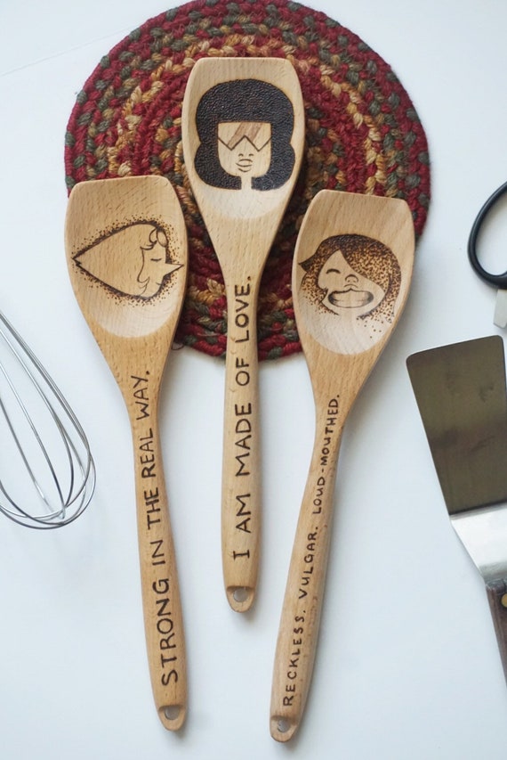 We... are the Crystal Gems! We’ll always save the day!  This set is three hand-burned wooden cooking spoons with freehand lettering - all one of a kind and made to order! OVERVIEW 👾 Spoons are made from hardwood and sanded to a smooth finish. 👾 Dimensions are 12 inches long, with a 2.75