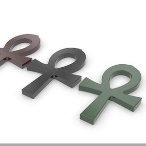 May include: Three Ankh symbols, one brown, one black, and one green, are arranged in a row on a white background.