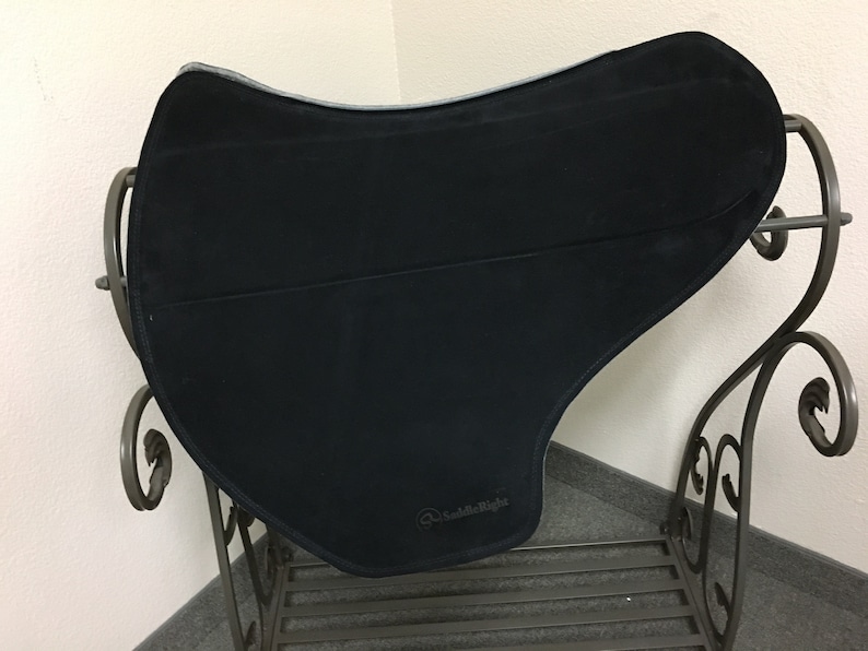 May include: Black saddle pad with a gray border and the text "SaddleRight" in white.