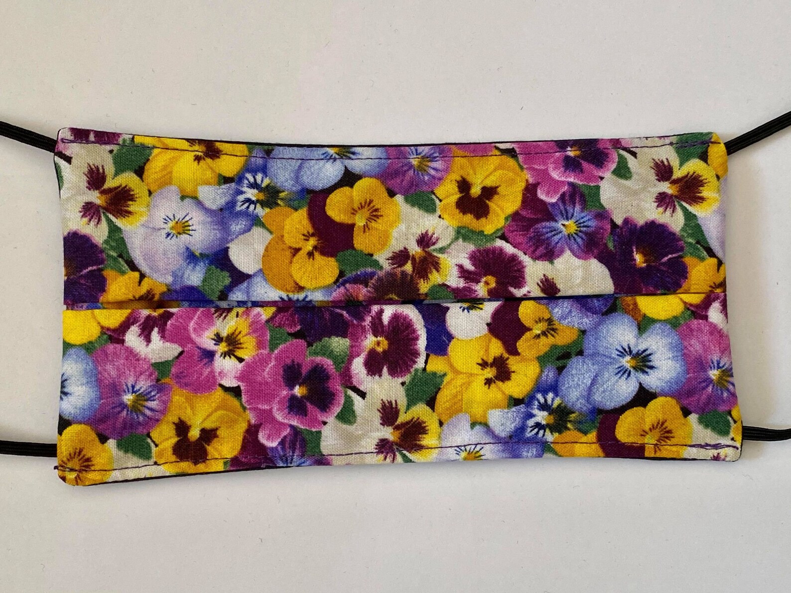Download Glorious Multi Color Pansies Face Mask. Reverse side is of ...