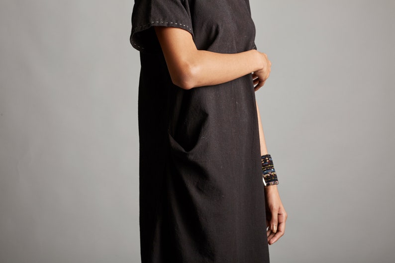Black organic cotton dress with side pockets Handcrafted black cotton pleated dress Little black dress with minimal embroidery