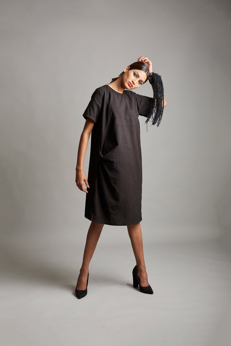 Black organic cotton dress with side pockets Handcrafted black cotton pleated dress Little black dress with minimal embroidery