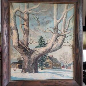 May include: A framed painting of a winter scene with a large tree in the foreground and a house in the background. The painting is done in a realistic style and features muted colors. The artist's signature, "Anna Landry '55", is visible in the bottom right corner.