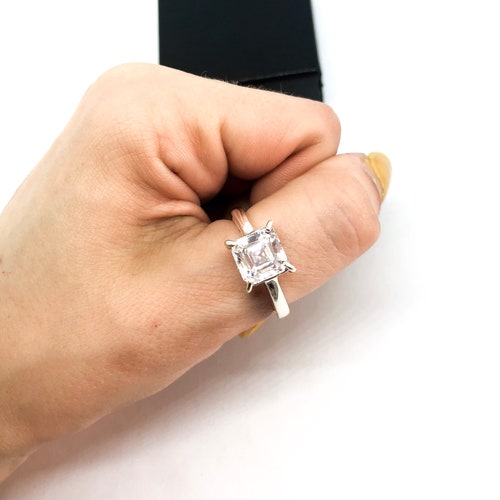 Solitaire/engagement style wedding ring. Sterling silver and 8.5 x 8.5 zirconia shops
