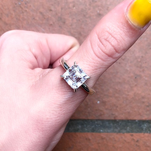 Solitaire/engagement style wedding ring. Sterling silver and 8.5 x 8.5 zirconia shops