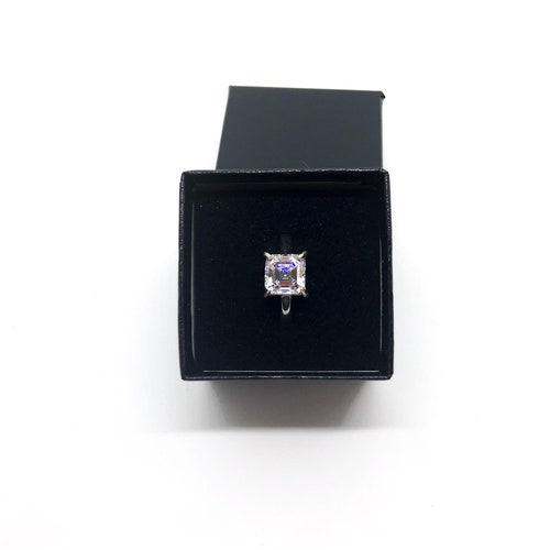 Solitaire/engagement style wedding ring. Sterling silver and 8.5 x 8.5 zirconia shops