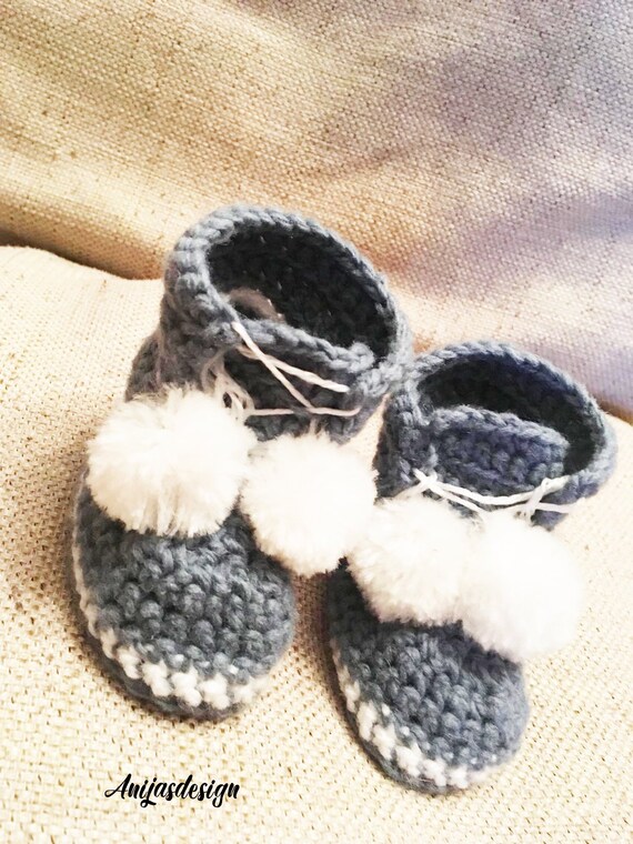 baby shoes with pom poms
