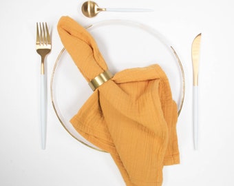 Set of 4 cloth napkins made of muslin in mustard yellow