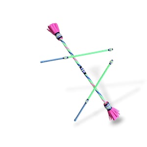 May include: Two juggling batons with bright pink fringed ends and shafts wrapped in diagonal stripes of neon green, blue, and purple. Each baton features a central grip section and a smaller end cap, with a textured surface throughout the length of the shafts.