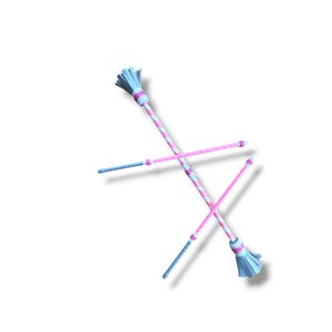 May include: Two baton twirling sticks featuring a pink and white diagonal striped pattern on the main shaft. Each baton has a light blue fringed end piece and a matching light blue handle section, with pink and white accents near the joints.