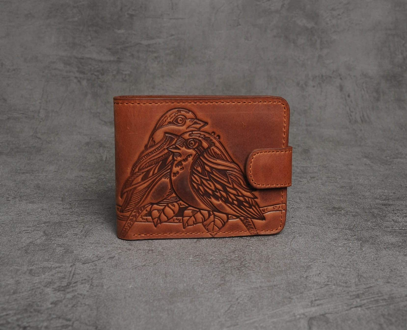 Leather coin-pocket wallet with all-over embossed eagle