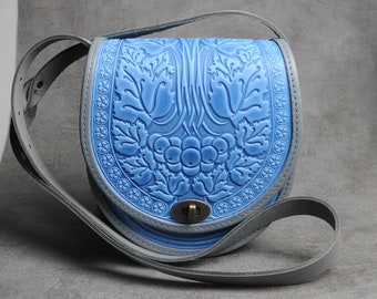 Bolso bandolera de piel azul: bandolera redonda con relieve
