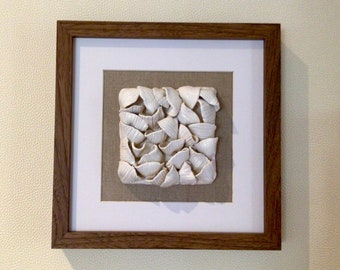 Decorative earthen shell frame