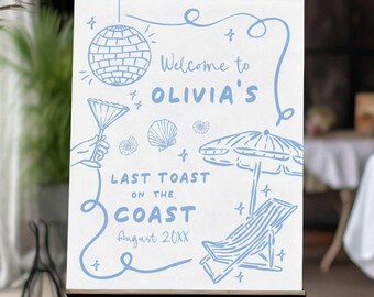 May include: A white welcome sign with blue text and illustrations. The sign says "Welcome to Olivia's Last Toast on the Coast August 20XX". The illustrations include a disco ball, a cocktail glass, seashells, a beach umbrella, and a lounge chair.