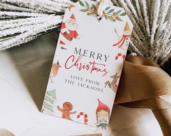May include: A white gift tag with a red and green Christmas theme. It features illustrations of Santa Claus, a snowman, a gingerbread man, a reindeer, a robin, and an elf. The text reads "Merry Christmas Love from The Jacksons".