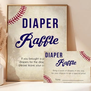 May include: A baseball-themed diaper raffle sign and card. The sign features the words "DIAPER Raffle" in navy blue, with baseball stitching accents. The card has the same design and includes space for a name.