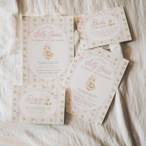 May include: A collection of baby shower invitations and cards with a whimsical design. The invitations feature the text "A Little Silly Goose is Almost on the Loose!" in pink script, along with a cartoon goose illustration and floral accents.