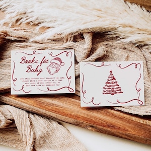 Puede incluir: Dos tarjetas blancas con texto e ilustraciones en color burdeos. Una tarjeta dice "Libros para beb&eacute;" con un gr&aacute;fico de Pap&aacute; Noel. La otra tarjeta presenta un &aacute;rbol de Navidad. Ambas tarjetas tienen bordes decorativos y texto.