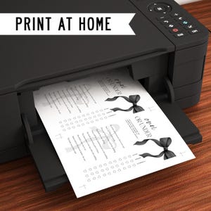 May include: Printable "Over or Under" game cards with a black and white design. The cards feature a black ribbon with a bow and the text "Over or Under".