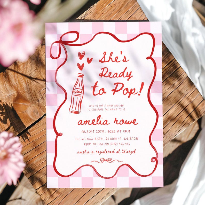May include: A pink and white gingham baby shower invitation with red text and accents. The invitation reads "She's Ready to Pop!" and includes details for the event, including the name "amelia rowe".