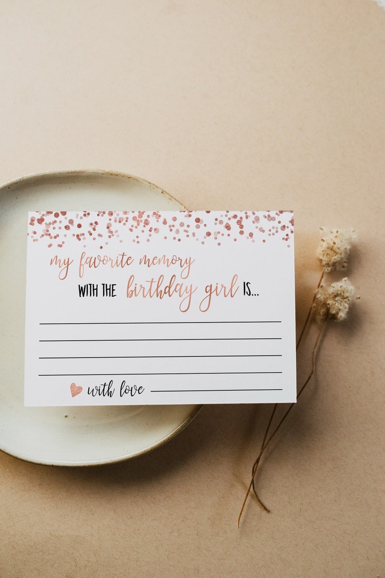 May include: A white card with a rose gold confetti background. The card has the text "my favorite memory with the birthday girl is..." with lines for writing. The card also has the text "with love" with a small heart.