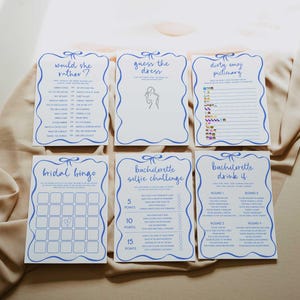 May include: A set of printable hen party games with blue and white borders. The games include "Would She Rather", "Guess the Dress", "Dirty Emoji Pictionary", "Bridal Bingo", "Hen Party Selfie Challenge", and "Hen Party Drink If".