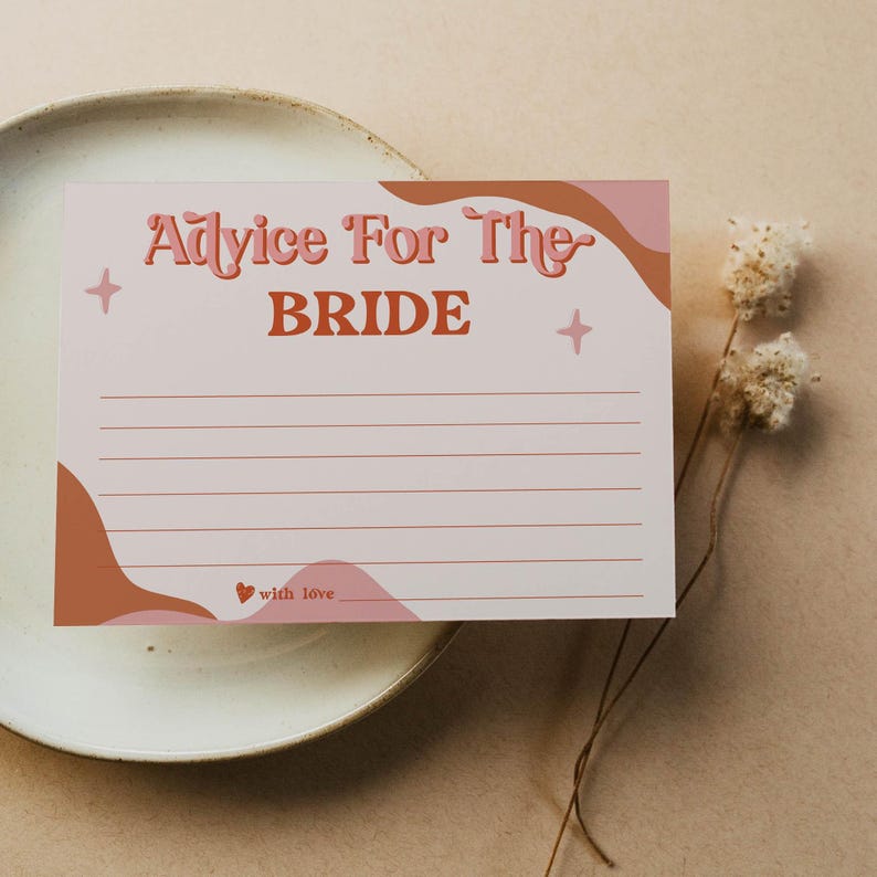 May include: A light pink advice card for the bride with the text "Advice For The BRIDE" in a retro font. The card has a wavy design in shades of pink and brown, with lines for writing and a small heart with the words "with love".