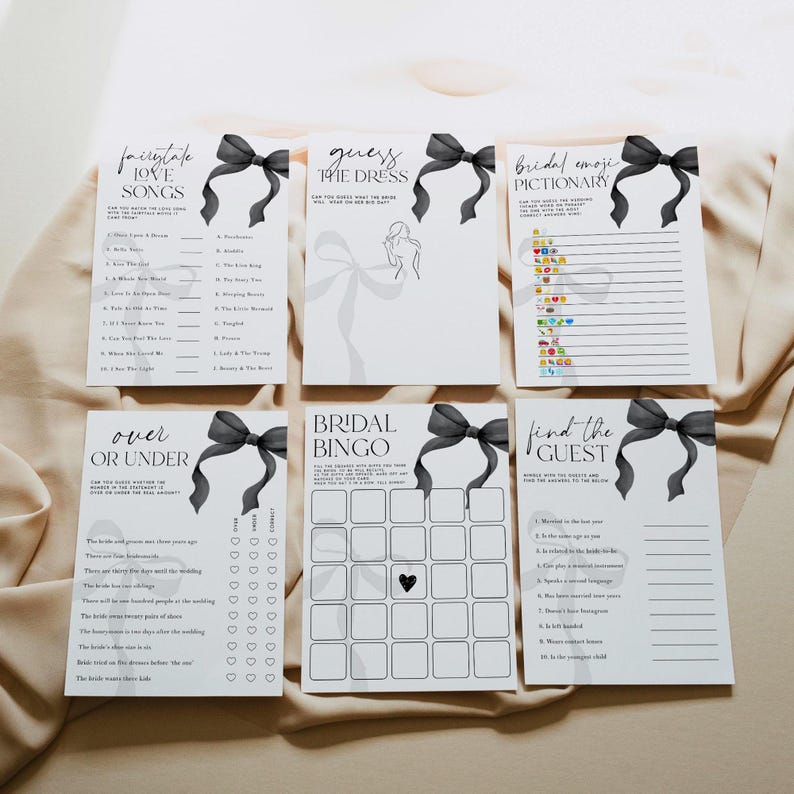 May include: A set of printable bridal shower games with black and white text and black bows. The games include "Fairy Tale Love Songs", "Guess the Dress", "Bridal Emoji Pictionary", "Over or Under", "Bridal Bingo", and "Find the Guest".