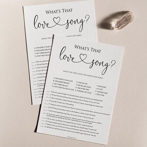 May include: A printable game with the title "What's That Love Song?"  The game asks players to match lyrics from popular love songs to their corresponding titles.  The game is printed on white paper with black text.
