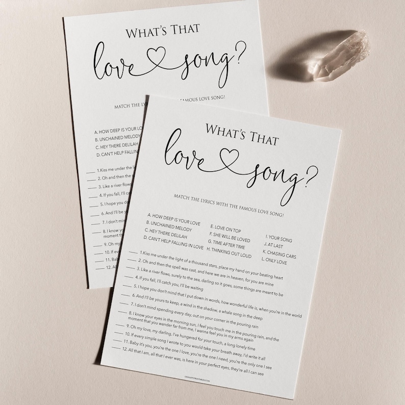 May include: A printable game with the title "What's That Love Song?"  The game asks players to match lyrics from popular love songs to their corresponding titles.  The game is printed on white paper with black text.