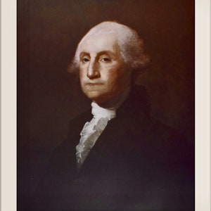 May include: A portrait painting of George Washington, the first president of the United States. He is wearing a dark suit with a white cravat and has a serious expression on his face.
