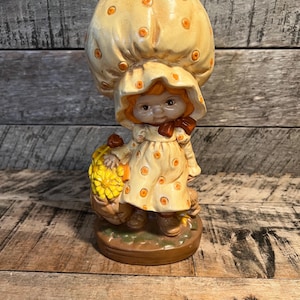 Ceramic Girl With With Yellow Polka Dot And Bonnet With Flowers
