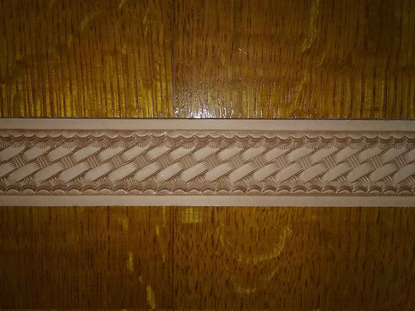 Hand tooled leather belt in basket weave pattern waiting for Etsy