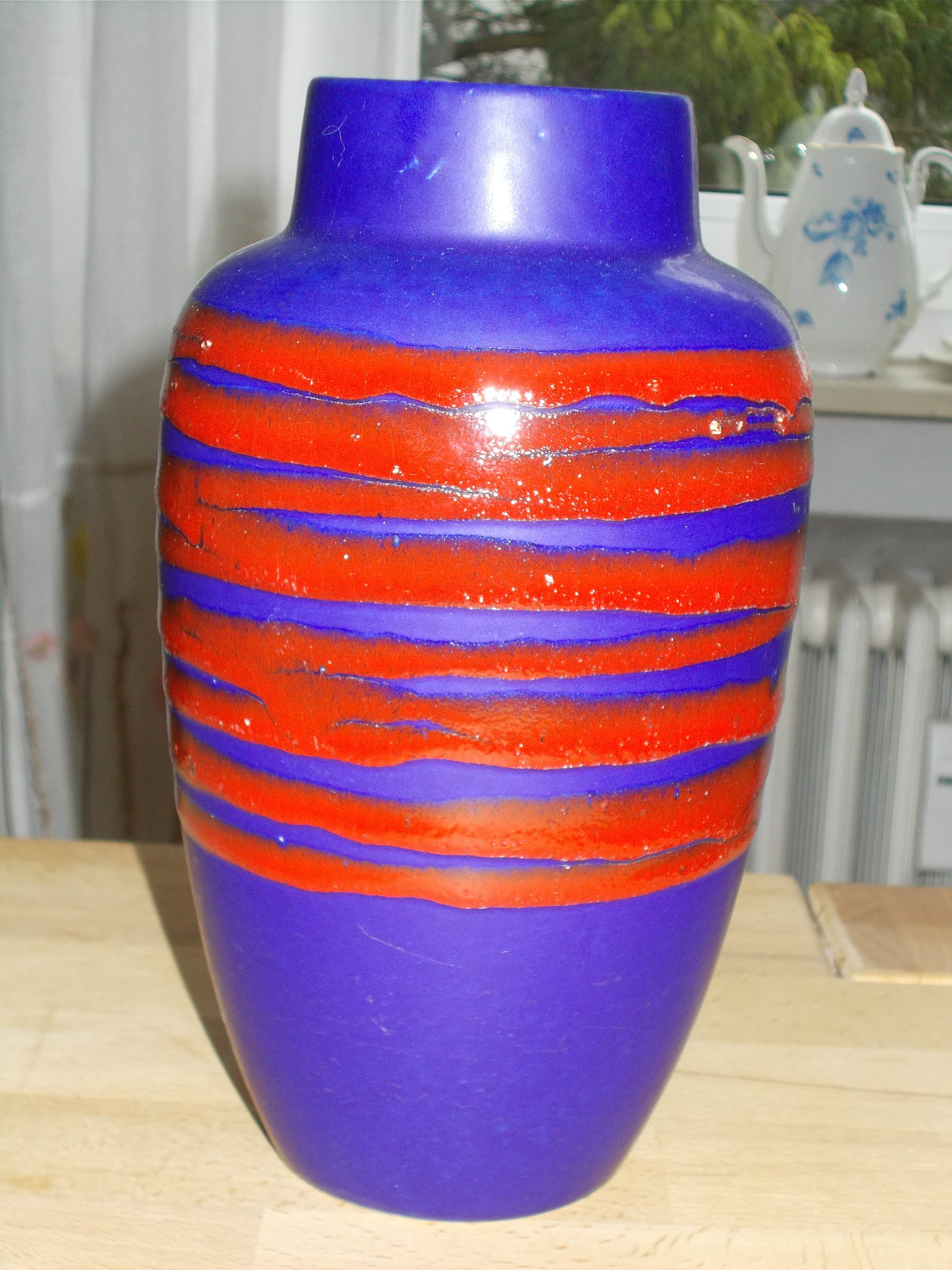 circumference 38.5 cm. Height 22 cm Ceramic vase in striking red and blue