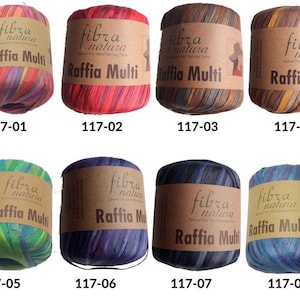 May include: Eight spools of Raffia Multi yarn in various colors, including red, blue, green, and brown. Each spool has a brown label with the text "fibra natura Raffia Multi" and a product code.