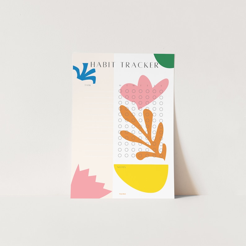 May include: A printable habit tracker with a floral design. The tracker has a section for a task, a grid of circles for tracking habits, and a notes section. The design features a pink heart, orange leaves, and a green circle.