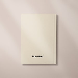 May include: A white book with the author's name "Rose Beck" printed on the spine.