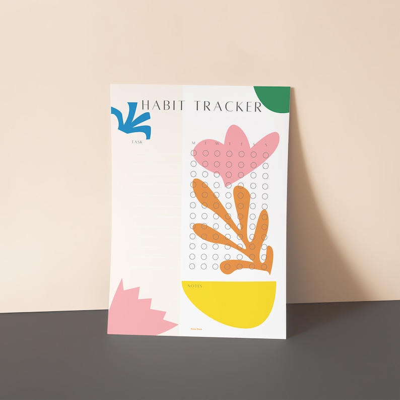 May include: A printable habit tracker with a floral design. The tracker has a section for a task list, a grid for daily tracking, and a notes section. The floral design features a pink flower, orange leaves, and a yellow circle.