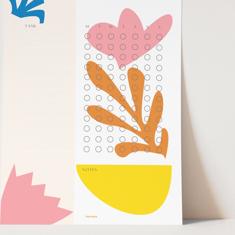 May include: A printable habit tracker with a floral design. The tracker has a pink flower with orange leaves and a yellow half-circle at the bottom. The tracker has a section for tasks and notes. The days of the week are labeled M, T, W, T, F, S, S.