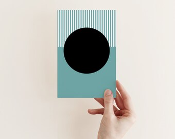 May include: A teal card with white stripes and a black circle in the center.