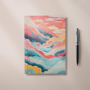 May include: A colourful notebook cover featuring an abstract design of clouds in shades of pink, blue, yellow, and green.